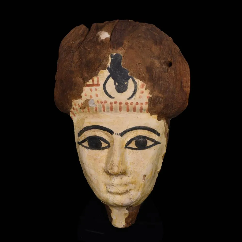 An Egyptian Wooden Mummy Mask, 21st Dynasty, ca. 1069 - 945 BCE